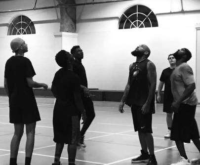 Young men enjoying some Bible and basketball at a recent Living H2O Initiative