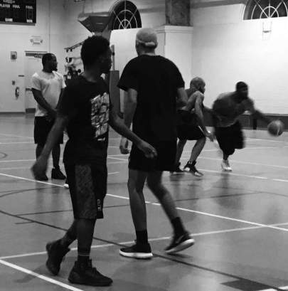 Young men enjoying some Bible and basketball at a recent Living H2O Initiative