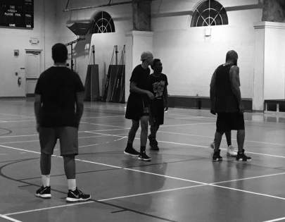 Young men enjoying some Bible and basketball at a recent Living H2O Initiative