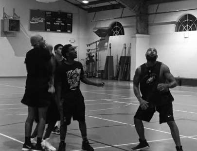 Young men enjoying some Bible and basketball at a recent Living H2O Initiative